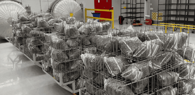 Production racks inside the operating Myzel Organics mushroom facility